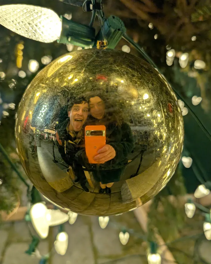 The two of us reflected in a gold ornament