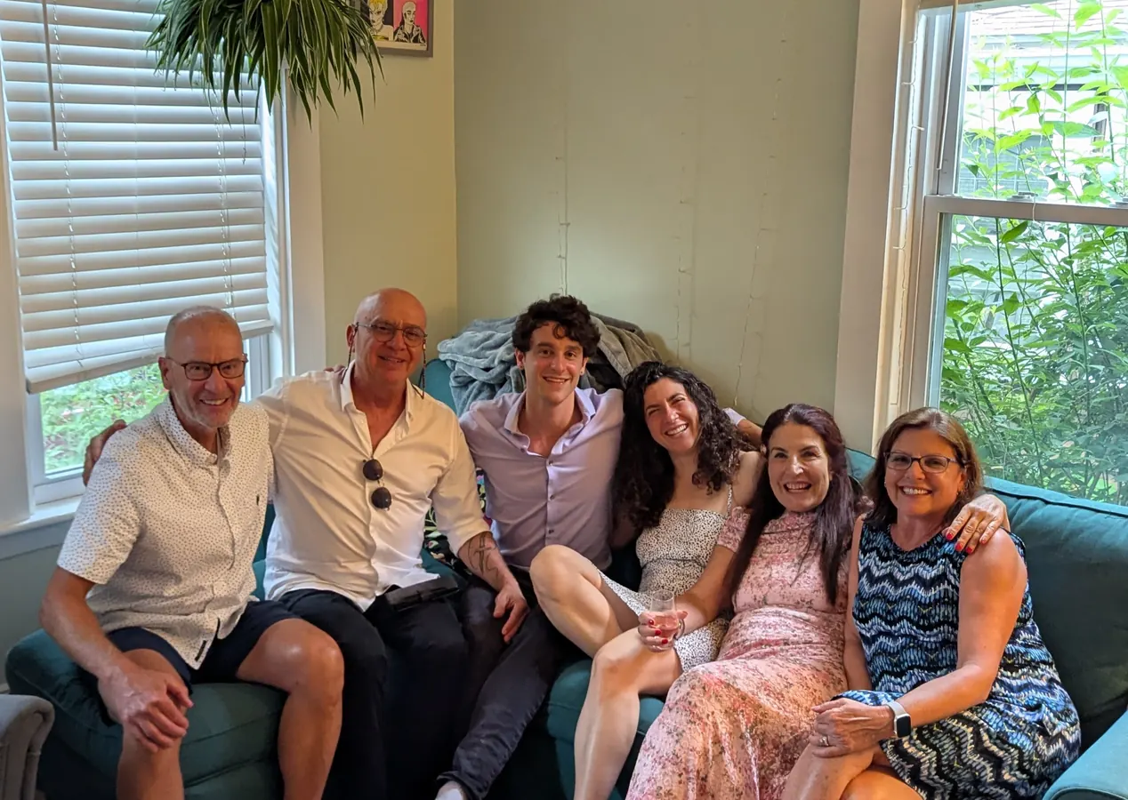 Both sets of parents packed onto one couch